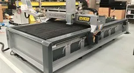 Soitaab technician servicing an industrial cutting machine